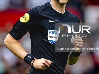 Referee Sander van der Eijk officiates the match between Feyenoord and NAC at Stadium De Kuip for the Dutch Eredivisie season 2024-2025 in R...