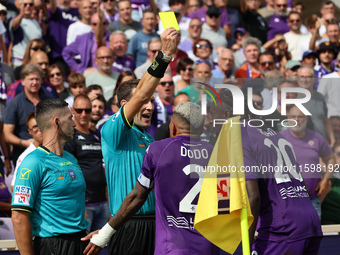 Referee Matteo Marcenaro shows Yellow to Moise Kean of ACF Fiorentina during the Italian Serie A football match between ACF Fiorentina and S...