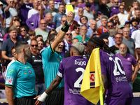 Referee Matteo Marcenaro shows Yellow to Moise Kean of ACF Fiorentina during the Italian Serie A football match between ACF Fiorentina and S...