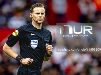 Referee Sander van der Eijk officiates the match between Feyenoord and NAC at Stadium De Kuip for the Dutch Eredivisie season 2024-2025 in R...