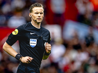 Referee Sander van der Eijk officiates the match between Feyenoord and NAC at Stadium De Kuip for the Dutch Eredivisie season 2024-2025 in R...