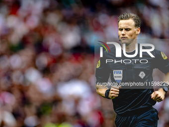 Referee Sander van der Eijk officiates the match between Feyenoord and NAC at Stadium De Kuip for the Dutch Eredivisie season 2024-2025 in R...