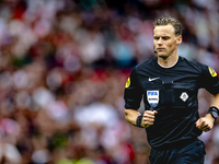 Referee Sander van der Eijk officiates the match between Feyenoord and NAC at Stadium De Kuip for the Dutch Eredivisie season 2024-2025 in R...