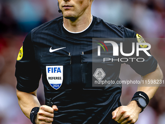 Referee Sander van der Eijk officiates the match between Feyenoord and NAC at Stadium De Kuip for the Dutch Eredivisie season 2024-2025 in R...