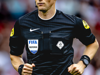 Referee Sander van der Eijk officiates the match between Feyenoord and NAC at Stadium De Kuip for the Dutch Eredivisie season 2024-2025 in R...