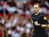 Referee Sander van der Eijk officiates the match between Feyenoord and NAC at Stadium De Kuip for the Dutch Eredivisie season 2024-2025 in R...