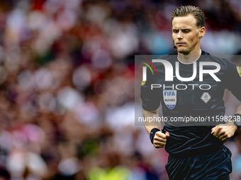 Referee Sander van der Eijk officiates the match between Feyenoord and NAC at Stadium De Kuip for the Dutch Eredivisie season 2024-2025 in R...