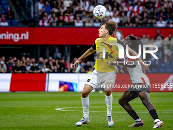 NAC Breda forward Leo Sauer and Feyenoord Rotterdam defender Jordan Lotomba during the match Feyenoord vs. NAC at Stadium De Kuip for the Du...