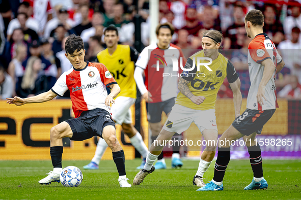 NAC Breda player Elias Mar Omarsson and Feyenoord Rotterdam midfielder Inbeom Hwang during the match Feyenoord vs. NAC at Stadium De Kuip fo...