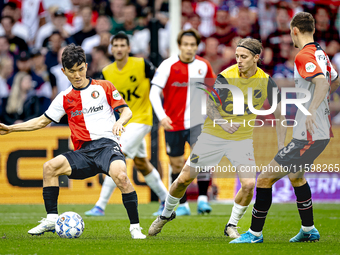 NAC Breda player Elias Mar Omarsson and Feyenoord Rotterdam midfielder Inbeom Hwang during the match Feyenoord vs. NAC at Stadium De Kuip fo...