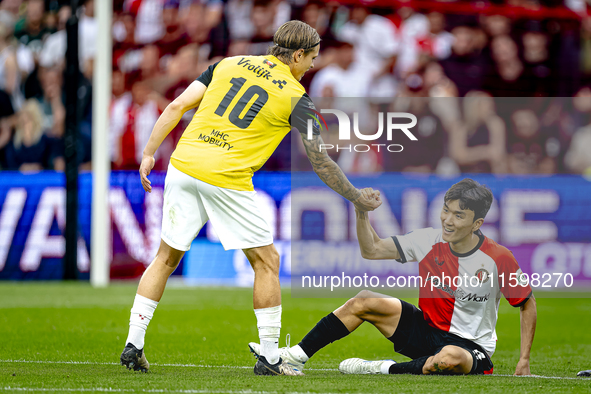 NAC Breda player Elias Mar Omarsson and Feyenoord Rotterdam midfielder Inbeom Hwang during the match Feyenoord vs. NAC at Stadium De Kuip fo...