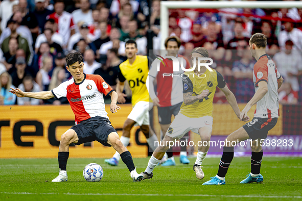 NAC Breda player Elias Mar Omarsson and Feyenoord Rotterdam midfielder Inbeom Hwang during the match Feyenoord vs. NAC at Stadium De Kuip fo...