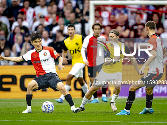 NAC Breda player Elias Mar Omarsson and Feyenoord Rotterdam midfielder Inbeom Hwang during the match Feyenoord vs. NAC at Stadium De Kuip fo...