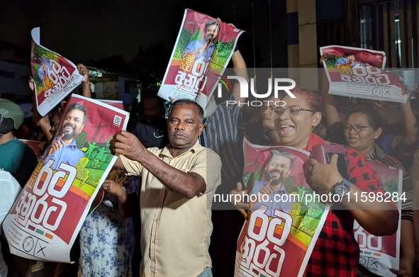 Supporters of Sri Lanka's new president, Anurakumara Dissanayake, celebrate his victory outside the election commission in Colombo, Sri Lank...