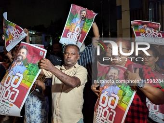 Supporters of Sri Lanka's new president, Anurakumara Dissanayake, celebrate his victory outside the election commission in Colombo, Sri Lank...