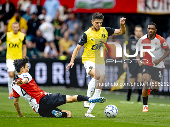 Feyenoord Rotterdam midfielder Inbeom Hwang and NAC Breda defender Fredrik Oldrup Jensen during the match between Feyenoord and NAC at Stadi...