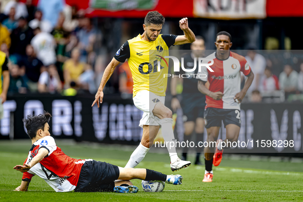 Feyenoord Rotterdam midfielder Inbeom Hwang and NAC Breda defender Fredrik Oldrup Jensen during the match between Feyenoord and NAC at Stadi...