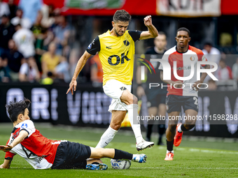 Feyenoord Rotterdam midfielder Inbeom Hwang and NAC Breda defender Fredrik Oldrup Jensen during the match between Feyenoord and NAC at Stadi...