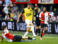 Feyenoord Rotterdam midfielder Inbeom Hwang and NAC Breda defender Fredrik Oldrup Jensen during the match between Feyenoord and NAC at Stadi...