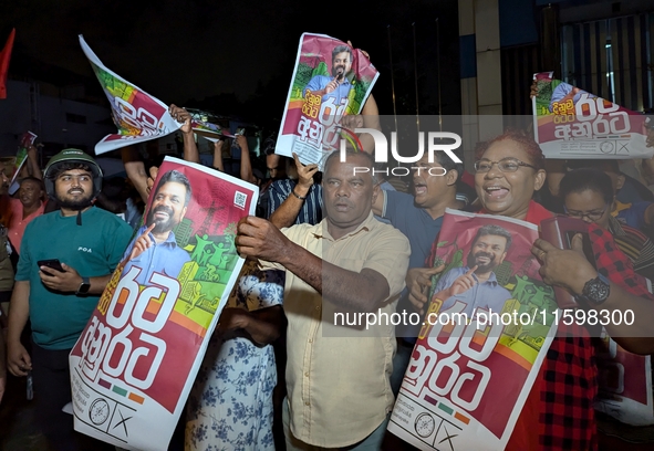 Supporters of Sri Lanka's new president, Anurakumara Dissanayake, celebrate his victory outside the election commission in Colombo, Sri Lank...