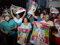 Supporters of Sri Lanka's new president, Anurakumara Dissanayake, celebrate his victory outside the election commission in Colombo, Sri Lank...