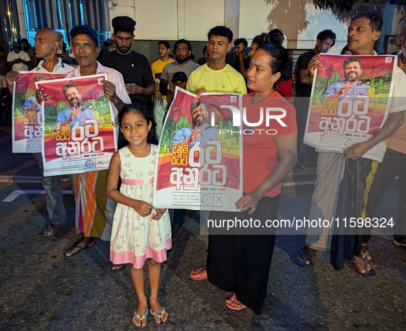 Supporters of Sri Lanka's new president, Anurakumara Dissanayake, celebrate his victory outside the election commission in Colombo, Sri Lank...