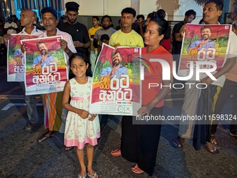 Supporters of Sri Lanka's new president, Anurakumara Dissanayake, celebrate his victory outside the election commission in Colombo, Sri Lank...