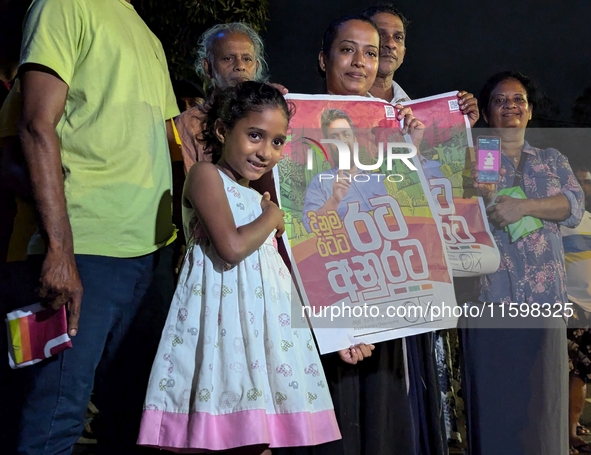 Supporters of Sri Lanka's new president, Anurakumara Dissanayake, celebrate his victory outside the election commission in Colombo, Sri Lank...