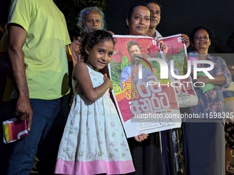 Supporters of Sri Lanka's new president, Anurakumara Dissanayake, celebrate his victory outside the election commission in Colombo, Sri Lank...