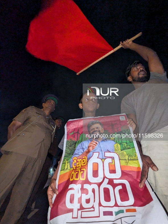 Supporters of Sri Lanka's new president, Anurakumara Dissanayake, celebrate his victory outside the election commission in Colombo, Sri Lank...