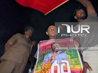 Supporters of Sri Lanka's new president, Anurakumara Dissanayake, celebrate his victory outside the election commission in Colombo, Sri Lank...