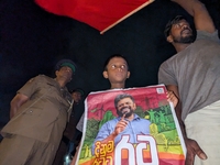 Supporters of Sri Lanka's new president, Anurakumara Dissanayake, celebrate his victory outside the election commission in Colombo, Sri Lank...