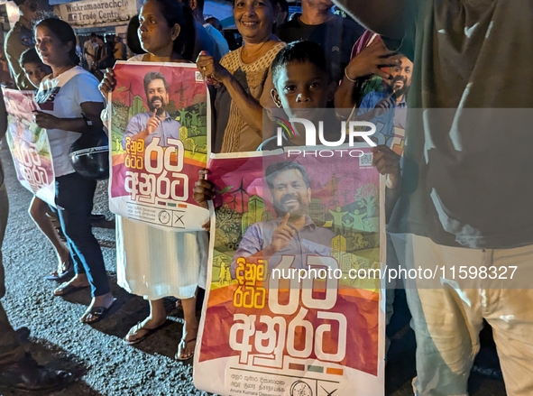 Supporters of Sri Lanka's new president, Anurakumara Dissanayake, celebrate his victory outside the election commission in Colombo, Sri Lank...