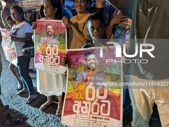 Supporters of Sri Lanka's new president, Anurakumara Dissanayake, celebrate his victory outside the election commission in Colombo, Sri Lank...