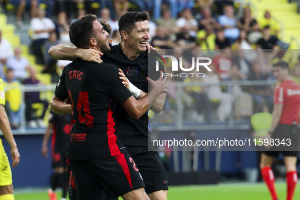 Robert Lewandowski of FC Barcelona celebrates after scoring the 0-2 goal with his teammate during the La Liga match between Villarreal CF an...