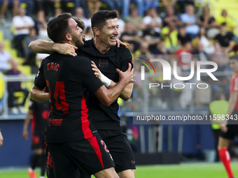 Robert Lewandowski of FC Barcelona celebrates after scoring the 0-2 goal with his teammate during the La Liga match between Villarreal CF an...