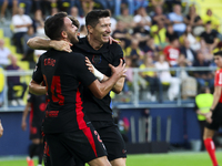 Robert Lewandowski of FC Barcelona celebrates after scoring the 0-2 goal with his teammate during the La Liga match between Villarreal CF an...