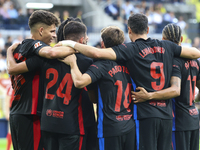 Robert Lewandowski of FC Barcelona celebrates after scoring the 0-2 goal with his teammate during the La Liga match between Villarreal CF an...