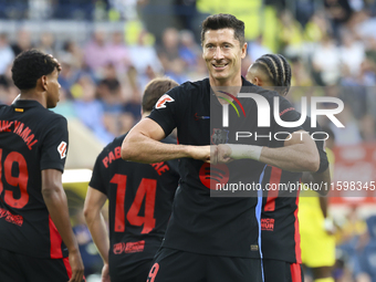 Robert Lewandowski of FC Barcelona celebrates after scoring the 0-2 goal with his teammate during the La Liga match between Villarreal CF an...