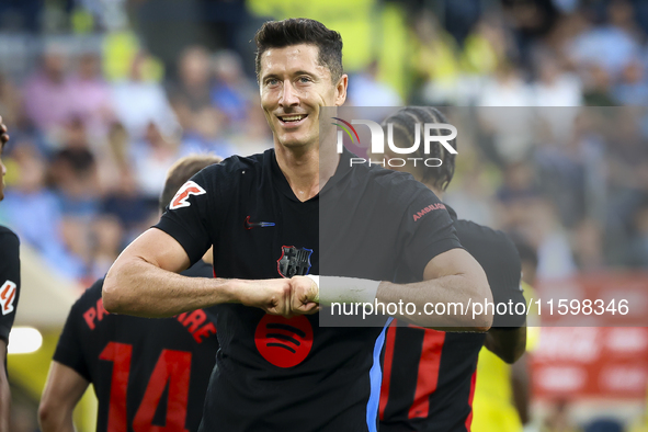 Robert Lewandowski of FC Barcelona celebrates after scoring the 0-2 goal with his teammate during the La Liga match between Villarreal CF an...