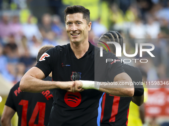 Robert Lewandowski of FC Barcelona celebrates after scoring the 0-2 goal with his teammate during the La Liga match between Villarreal CF an...