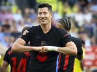 Robert Lewandowski of FC Barcelona celebrates after scoring the 0-2 goal with his teammate during the La Liga match between Villarreal CF an...