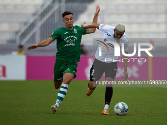 Carlo Zammit Lonardelli of Floriana closely follows Alex Bruno de Souza Silva of Hibernians during the Malta 360 Sports Premier League socce...