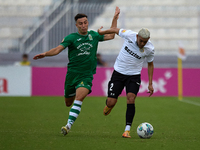 Carlo Zammit Lonardelli of Floriana closely follows Alex Bruno de Souza Silva of Hibernians during the Malta 360 Sports Premier League socce...