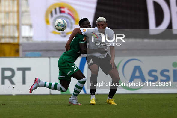 Franklin Sasere (L) of Floriana vies for the ball with Nunes Silva Pedro Henrique (R) of Hibernians during the Malta 360 Sports Premier Leag...