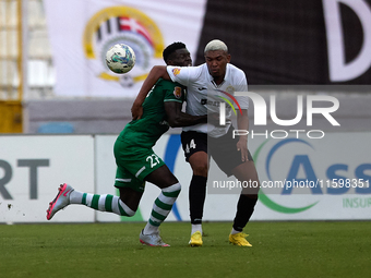 Franklin Sasere (L) of Floriana vies for the ball with Nunes Silva Pedro Henrique (R) of Hibernians during the Malta 360 Sports Premier Leag...