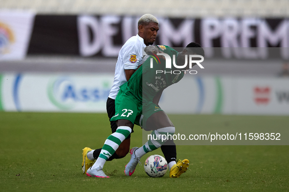 Franklin Sasere of Floriana is challenged from the back by Nunes Silva Pedro Henrique of Hibernians during the Malta 360 Sports Premier Leag...