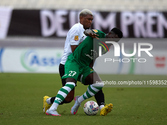 Franklin Sasere of Floriana is challenged from the back by Nunes Silva Pedro Henrique of Hibernians during the Malta 360 Sports Premier Leag...