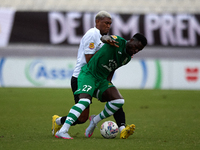 Franklin Sasere of Floriana is challenged from the back by Nunes Silva Pedro Henrique of Hibernians during the Malta 360 Sports Premier Leag...