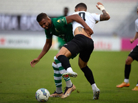 Oualid El Hasni of Floriana competes for the ball with Miullen Natha Felicio Carvalho of Hibernians during the Malta 360 Sports Premier Leag...